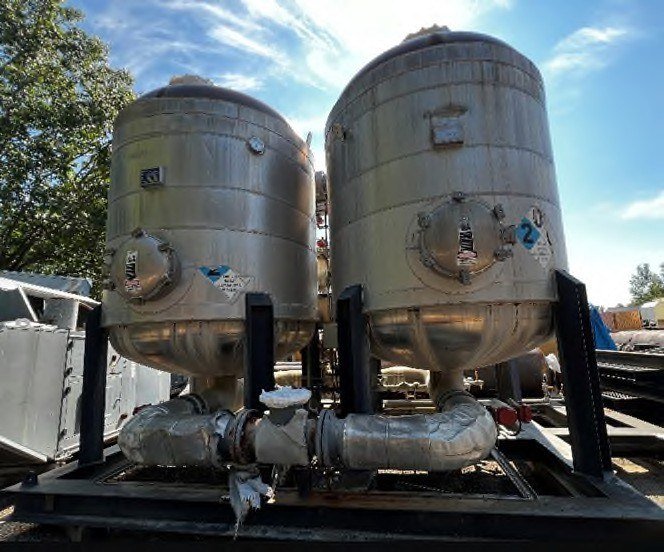 Paired treatment-vessel skids